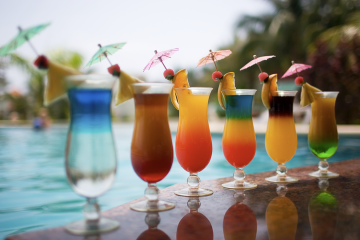 Poolside tropical drinks from a luxury home bar