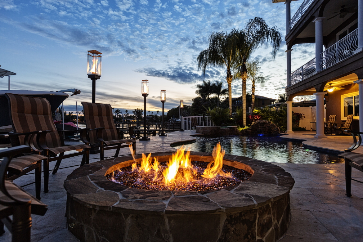 This fire feature adds a touch of elegance and luxury to this coastal home pool.